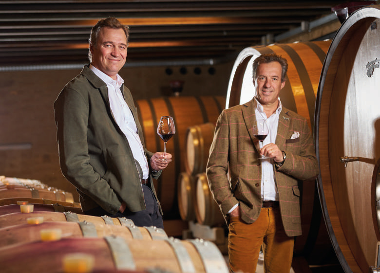 Two men tasting wine in Château Gigognan cellar